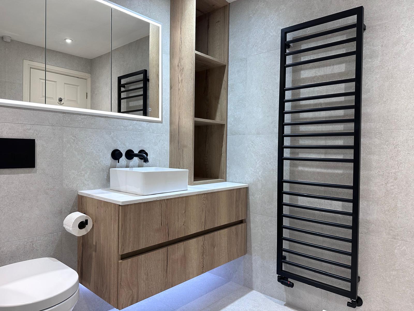 Grey wet room in Leeds with a walk-in shower and freestanding bath